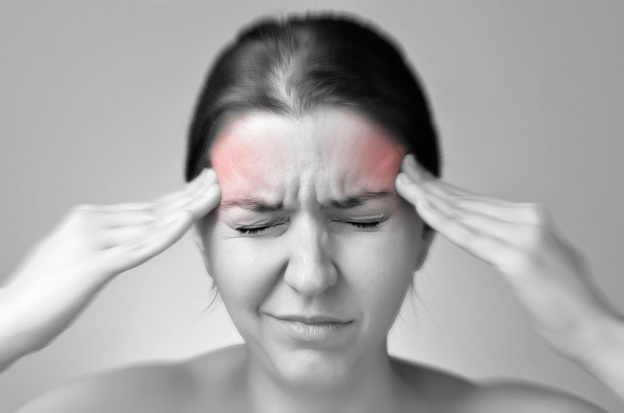 Young woman having migraine